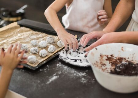 two-sisters-mother-preparing-chocolate-cookie-kitchen_23-2148044385